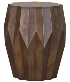 a wooden stool with geometric designs on it's sides and the top half painted brown