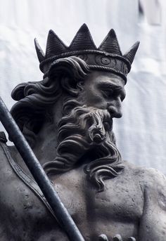 black and white photograph of a statue of a man wearing a crown