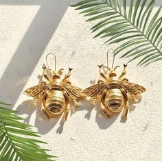 "Spice up any outfit with our big buzzing bee earrings. Our large hollow backed metal bee earrings are approximately 3\"inches long including the ear wire. Made from gold color zinc alloy metal." Metal Bee, Bumble Bee Earrings, Gold Bee, Bee Earrings, Heart Print, Ear Wire, Spice Up, Spice Things Up, Zinc Alloy