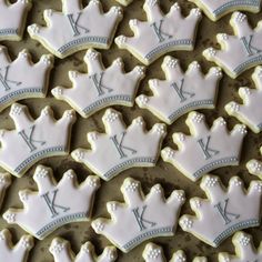 decorated cookies with royal crowns are arranged on a baking sheet to look like they have been cut out