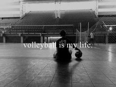 a person sitting on the floor with a ball in front of them and an inscription that reads volleyball is my life