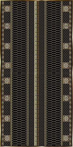 a black and gold striped rug with an intricate design on the bottom, in front of a