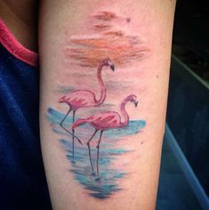 a flamingo tattoo on the left arm