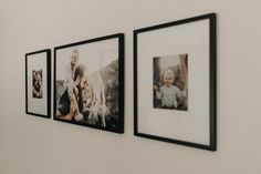 three black and white photos hanging on the wall next to each other, one is holding a baby