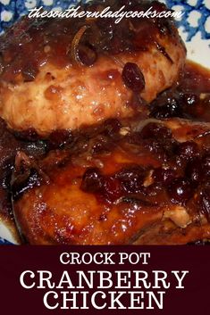 crock pot cranberry chicken recipe on a blue and white plate with the title crock pot cranberry chicken