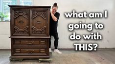 a man standing next to an old dresser with the words what am i going to do with this?