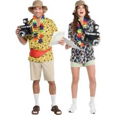 two people are dressed up in costumes and hats, one is holding a camera while the other holds a piece of paper