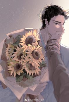 a man holding a bouquet of sunflowers in his hand