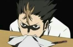 an anime character with his face painted black and white, sitting at a table in front of a napkin