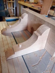 a wooden bench being built in a shop