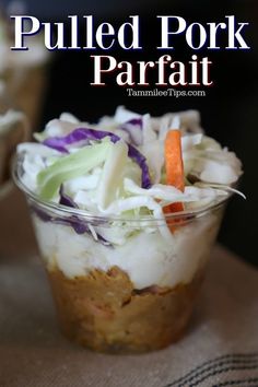 pulled pork parfait in a glass dish with carrots and cabbage on top