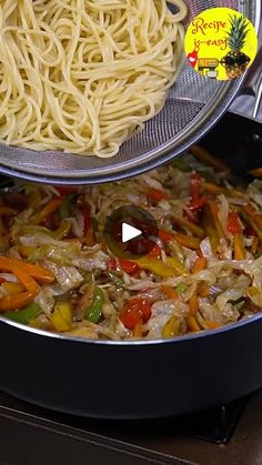 two pans filled with noodles and vegetables on top of a stove burner next to each other