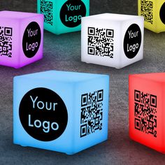 six glowing cubes with qr - code on them, all in different colors