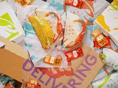 an assortment of snacks and condiments laid out on a table with the words delving