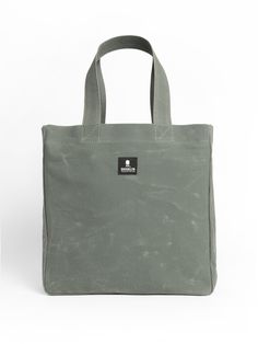 Medium Waxed Canvas Tote Bag in Khaki - BROOKLYN INDUSTRIES Khaki Duck Canvas Bag With Canvas Lining, Casual Waxed Canvas Tote Bag, Everyday Duck Canvas Bag With Waxed Finish, Everyday Waxed Canvas Bag, Outdoor Khaki Bags With Waxed Finish, Khaki Waxed Finish Bags For Outdoor, Everyday Cotton Shoulder Bag With Waxed Finish, Everyday Khaki Duck Canvas Bag, Cotton Tote Bag With Waxed Finish