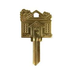 a gold key shaped like a house with a door and window on the front side