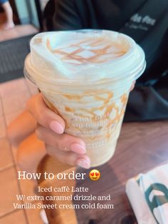 a woman holding up a cup of coffee with the words how to order iced cafe latte