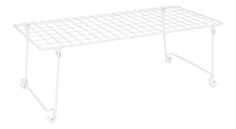 a white wire shelf with wheels on it