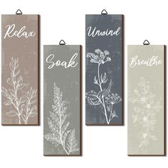 four hanging signs with herbs on them