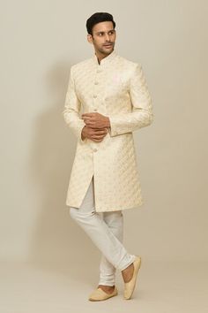 Cream sherwani featuring floral motif thread and sequin work all over. Paired with a white churidar. - Aza Fashions Luxury Off White Chanderi Sherwani, Transitional Cream Chanderi Sherwani, Luxury Off-white Sherwani With Resham Embroidery, Festive Semi-stitched Cream Sherwani, Luxury Cream Semi-stitched Sherwani, White Churidar, Men Cream, Cream Silk, Cocktail Reception