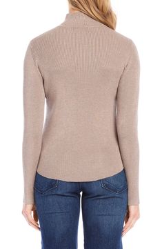 This stretchy top detailed with a cute mock neck makes a perfect layering piece. 25" length (size Medium) Mock neck Long sleeves 70% rayon, 30% nylon Hand wash, dry flat Imported Spring Layering High Neck Sweater, Spring High Neck Knit Turtleneck, Fitted Knit Mock Neck Top For Fall, High Neck Textured Knit Top For Layering, Fitted Fine Knit Mock Neck Top, Knit High Neck Turtleneck For Spring, Textured Knit High Neck Top For Layering, Spring Knit Turtleneck, High Stretch Knit Turtleneck Top