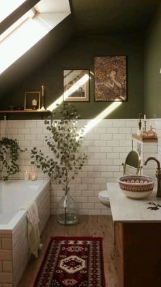 a bath room with a tub a sink and a rug