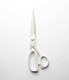 a pair of scissors sitting on top of a table