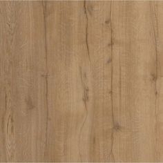 a close up view of the wood grains on this flooring material, which is light brown