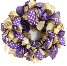 a purple and gold polka dot mesh wreath