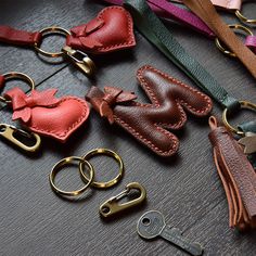 several different types of leather keychains on a table