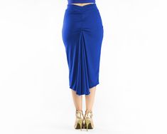 "This handmade reversible ''Vina'' high waisted tango skirt is made with a soft jersey fabric in 2 different colors. Fully reversible, 2 in 1 skirt! A must- have skirt for milongas. Featuring a back ruched fishtail which eases movement while dancing, this skirt is elegant and very comfortable for dancing! Available in different colors and sizes. Details: - High waist band. - Fully reversible. Two layers, blue and black - Front length: 68 cm/ 26.7 in (If you need a different length, please, let m Fitted Midi Draped Skirt With Gathered Detail, Blue Stretch Gathered Skirt, Fitted Ruched Draped Midi Skirt, Fitted Blue Midi Skirt, Blue Long Wrap Skirt, Fitted Long Blue Wrap Skirt, Blue Fitted Long Wrap Skirt, Fitted Blue Dance Bottoms, Blue Stretch Asymmetrical Skirt