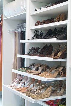 a closet filled with lots of different types of shoes