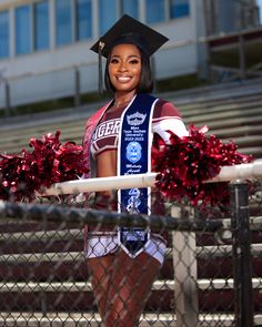 a cheerleader is standing in front of the bleachers