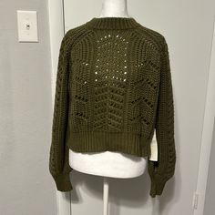 Green / Olive Knitted Sweater New With Tags - Never Worn Waist Length Size Small - But Can Fit Like A Medium Green Pointelle Knit Top For Fall, Casual Open Knit Cropped Sweater, Green Pointelle Knit Sweater, Green Pointelle Knit Top For Winter, Green Open Knit Crew Neck Top, Green Open Knit Top For Fall, Green Crew Neck Open Knit Top, Casual Cropped Open Knit Sweater With Crew Neck, Green Open Knit Cardigan