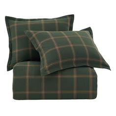 two green plaid pillow cases sitting next to each other