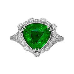 A Breathtakingly Striking  HANDMADE 14k White Gold Ring with Beautiful Modified Triangular Cut Tsavorite in Green color! The GEM is 4.30 CT and measures 9.70x9.94x6.17 mm! This Stone will take your breath away, especially on the sunlight! You will want to look at this stone endlessly. The mounting is a masterpiece! HANDMADE 14K White Gold Mounting (tested), that was is custom made to Accommodate this Beauty of a Gem in Prongs setting! Super FINE Workmanship on the Diamond prong  setting with 42 pcs Brilliant Full Cut Diamonds in GH color, SI1 clarity, totaling to approx 0.7 ct! Fabulous Braided Band and Diamond Gallery! The Entire Top's outline is 14.5x14.7 mm- HUGE. The Ring weights 5.8 g, nice and SOLID. Sits 8.1 mm off the top of the finger. Finger size 7.5 (Free Re-sizing with purchase Luxury Trillion Cut Emerald Ring For Formal Occasions, Luxury Gia Certified Trillion Cut Emerald Ring, Luxury Gia-certified Trillion Cut Emerald Ring, Luxury Trillion-cut Emerald Ring, Luxury Green Heart Cut Rings, Luxury Trillion Cut Emerald Jewelry, Formal Trillion-cut Emerald Jewelry, Trillion Cut Green Diamond Ring, Luxury Jewelry With Trillion Cut Center Stone