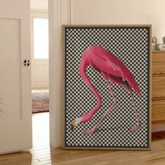 a pink flamingo standing on top of a checkered floor next to a dresser