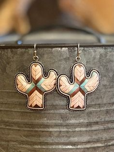 Western Aztec Cactus Earrings These earrings measure at approximately 3" in length. Lightweight, hypoallergenic, lead, and nickel-free! Aztec Cactus, Western Aztec, Cactus Earrings, Boutique Clothing, Cuff Bracelets, Cactus, Jewelry Accessories, Shoe Jewelry, Cream