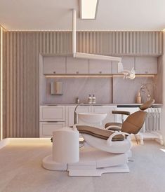 a modern dentist's chair and sink in the middle of a room with white walls