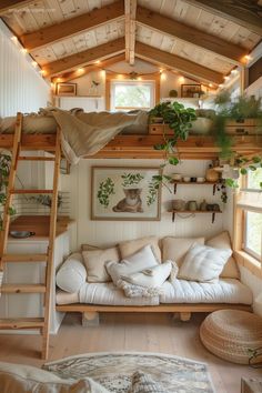 there is a loft bed with a couch underneath it and lights strung from the ceiling