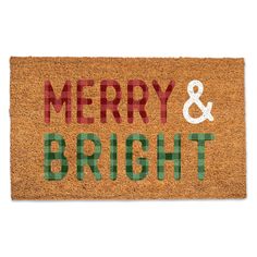 merry and bright door mat with the words'merry & bright'on it in red, green, and white