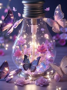 a light bulb filled with lots of butterflies next to pink flowers and lights on the ground