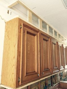 the kitchen cabinets are being installed in order to match the wall color and ceiling height