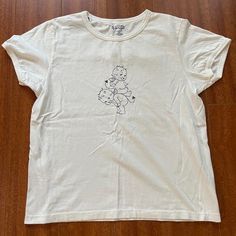 White Brandy Melville Devil Baby Cherub Graphic T-Shirt Brand No Flaws Cherub Brandy Melville, Brandy Melville Cherub Top, Brandy Melville Baby Tee, Brandy Melville Graphic Tees, Brandy Melville Shirts, White Wrap Top, Brandy Melville T Shirts, Dream Wishlist, Wishlist 2024