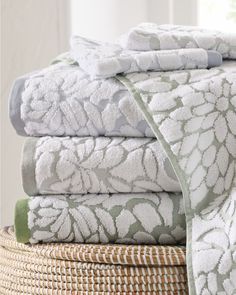 towels stacked on top of each other in a basket