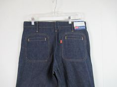 "Vintage 1970s Levi's hippy pants, bellbottom jeans. Has two front pockets, two rear pockets, zip fly and wide bell bottoms. Made in U.S.A. by Levis. Has original paper tag. Size 33 x 36. Actual measurements are: 33.5\" at the waist 39\" hips 38.5\" inseam 12.5\" rise 26\" bell In excellent unused condition. New old stock." Vintage Wide Leg Jeans With Pockets, 1970s Wide Leg Pants With Pockets, Vintage Denim Pants With Hip Pockets, Vintage Full-length Pants With Patch Pockets, 1970s Fitted Jeans With Pockets, Vintage Jeans With Pockets, Vintage Full Length Pants With Patch Pockets, Vintage Wide Leg Flare Jeans With Five Pockets, Vintage Wide Leg Pants With Hip Pockets