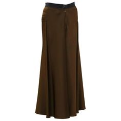 For Sale on 1stdibs - Early 2000's Gaultier brown maxi skirt. Horizontal quilting details on the hips with a pant style front button and zipper closure. The cotton waistband Fall Full Length Brown Maxi Skirt, Brown Full Length Maxi Skirt For Fall, Brown Full-length Maxi Skirt For Fall, Elegant Brown Full-length Maxi Skirt, Elegant Brown Full Length Maxi Skirt, Brown Fitted Full Length Skirt, Brown Full-length Lined Skirt, Fitted Brown Lined Maxi Skirt, Fitted Brown Maxi Skirt For Workwear