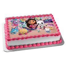 a pink and white cake with cartoon characters on it