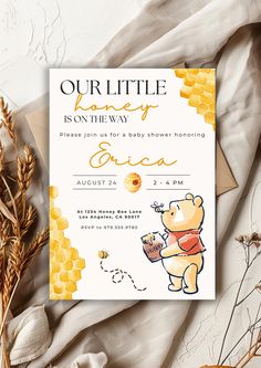 a winnie the pooh baby shower party with honey and bees on it's back