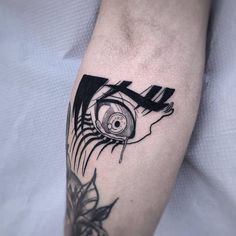 a person with a tattoo on their arm has an eye in the center of his arm